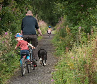 Family cycling in the countryside